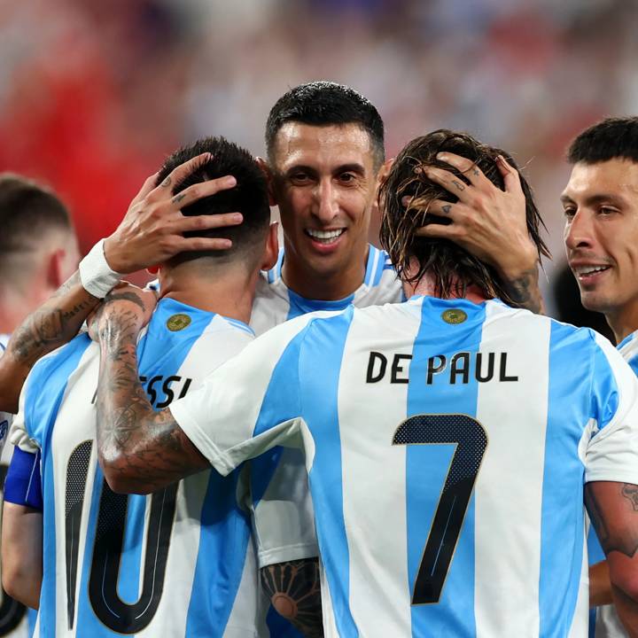 EAST RUTHERFORD, NEW JERSEY - JULY 09: Lionel Messi of Argentina celebrates after scoring the team's second goal with teammates Angel Di Maria and Rodrigo De Paul during the CONMEBOL Copa America 2024 semifinal match between Canada and Argentina at MetLife Stadium on July 09, 2024 in East Rutherford, New Jersey. (Photo by Sarah Stier/Getty Images)