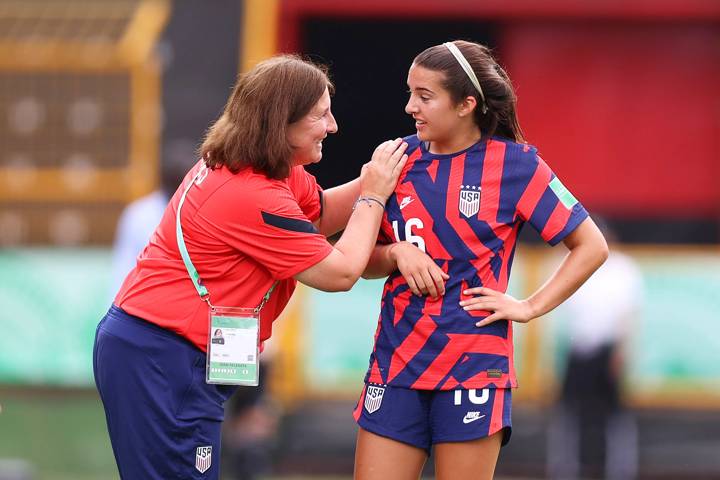 Tracey Kevins, coach of USA, speaks with Lauren Flynn