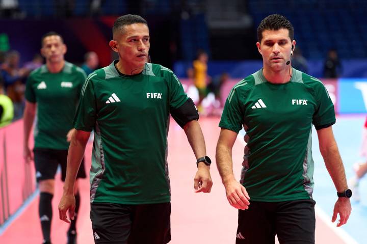 Referees Jorge Antonio Flores Hernandez and Aymen Kammoun warm up