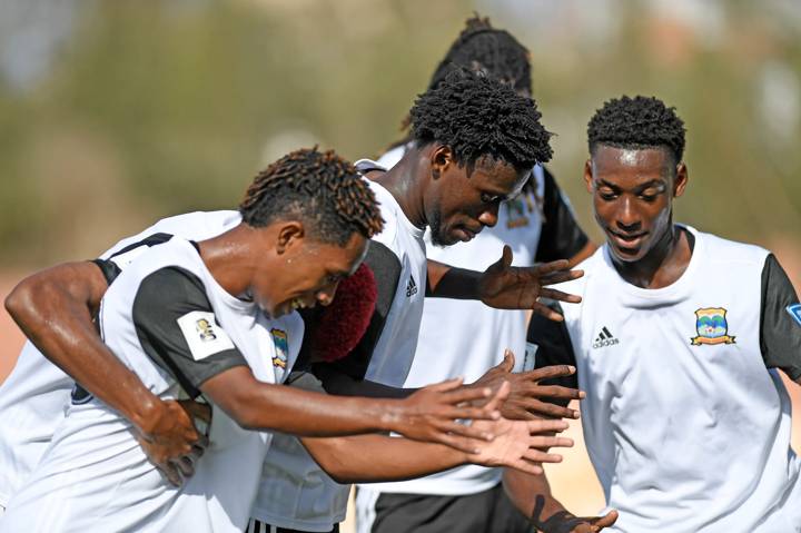 Ryan Henriette of Seychelles celebrates with teammates 