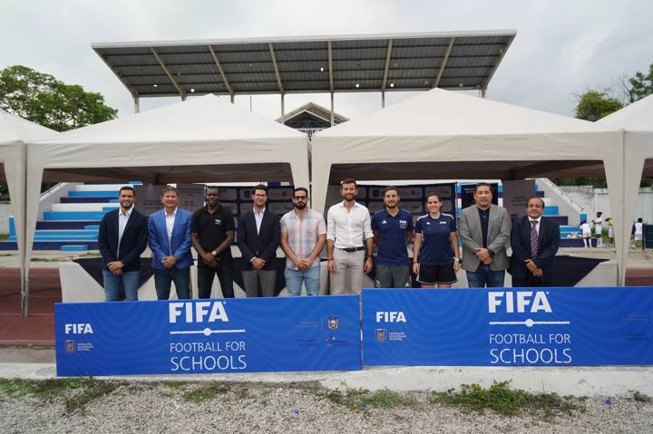 Authorities are seen during the launch of the FIFA Football for Schools program in Ecuador