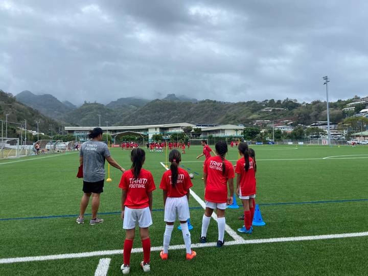 Girls attend a football clinic in Tahiti. Emma Evans Photo