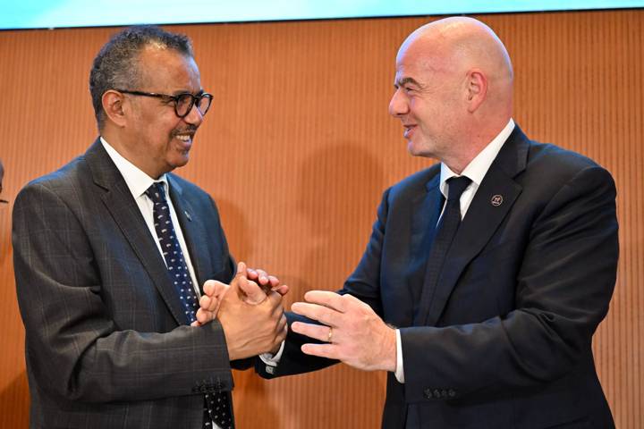 FIFA President Gianni Infantino (R) with WHO Director-General Dr Tedros Adhanom Ghebreyesus (L) during the 76th World Health Assembly