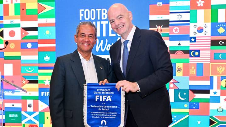 PARIS, FRANCE - JULY 22: FIFA President Gianni Infantino and Dominican Republic Football Association President Jose Deschamps pose for a photo with pennant during the Celebratory Lunch on the sidelines of the Olympic Games Paris 2024 at FIFA Paris offices on July 22, 2024 in Paris, France. (Photo by Harold Cunningham/FIFA)