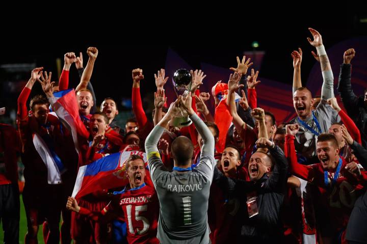 Predrag Rajkovic of Serbia holds up the FIFA U-20 World Cup trophy