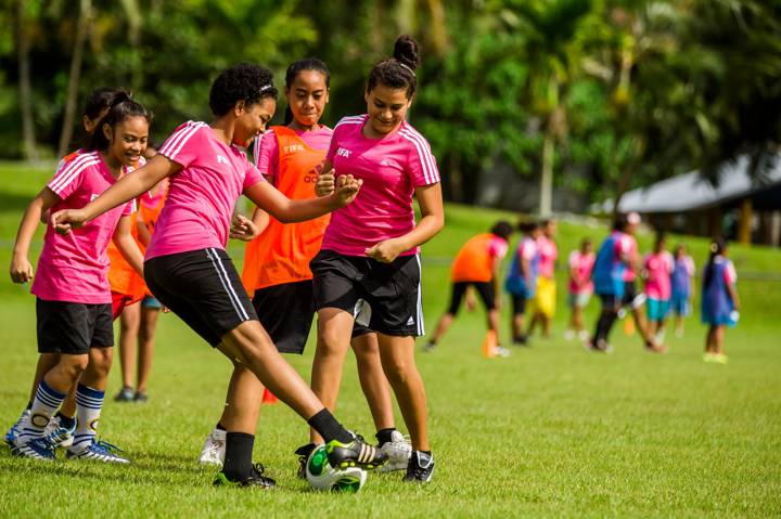 Girls playing football