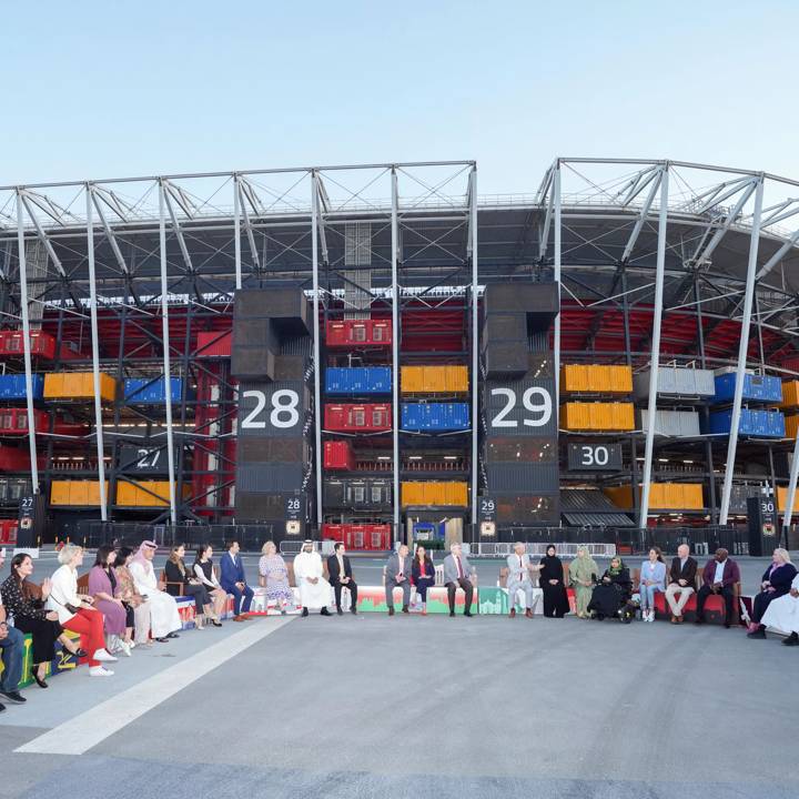 Ministry of Public Health officials in Doha, pictured on a Friendship Bench at 974 Stadium in Doha