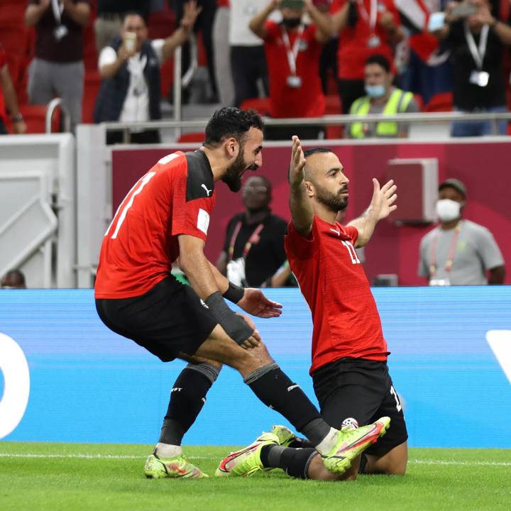 AL KHOR, QATAR - DECEMBER 01: Mohamed Afsha of Egypt celebrates with teammate Mohanad Lasheen after scoring their team's first goal from a penalty during the FIFA Arab Cup Qatar 2021 Group D match between Egypt and Lebanon at Al Thumana Stadium on December 01, 2021 in Al Khor, Qatar. (Photo by Maddie Meyer - FIFA/FIFA via Getty Images)