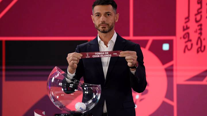 ZURICH, SWITZERLAND - NOVEMBER 29: Presenter, Adriano Del Monte displays the card of Tonga or The Cook Islands during the FIFA World Cup Qatar 2022 OFC Preliminary draw in Zurich, Switzerland on November 29, 2021 in Zurich, Switzerland. (Photo by Alexander Scheuber - FIFA/FIFA via Getty Images)