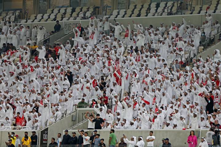 Fans cheer during the Qatar Stars League match between Al-Arabi and Al-Rayyan at the Lusail Stadium