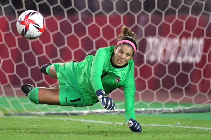 Stephanie Labbe #1 of Team Canada saves the Team Brazil fifth penalty taken by Rafaelle #4 to win in the penalty shoot out during the Women's Quarter Final.