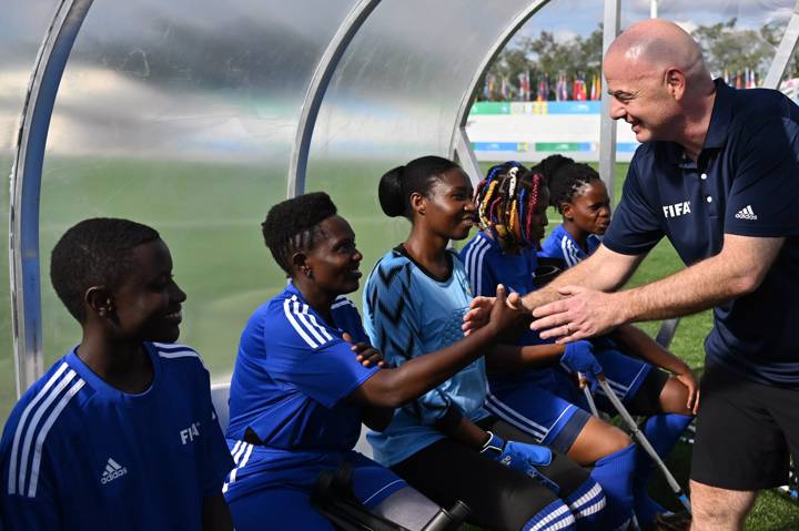 FIFA President Gianni Infantino shakes hands with players during the WAFF Women Amputee Football event