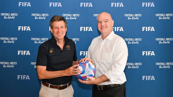 PARIS, FRANCE - AUGUST 05: FIFA President Gianni Infantino and World Athletics President Sebastian Coe pose with an Olympic Games Paris 2024 official match ball during a meeting between FIFA and the World Athletics President at FIFA's Paris office on August 05, 2024 in Paris, France. (Photo by Harold Cunningham/FIFA)