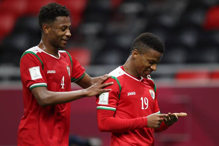 Al Mandhar Al Alawi of Oman celebrates with teammate Arshad Al Alawi after scoring