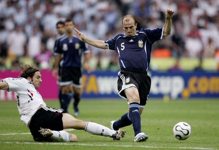 Germany's Torsten Frings in action against Argentina's Esteban Cambiasso 