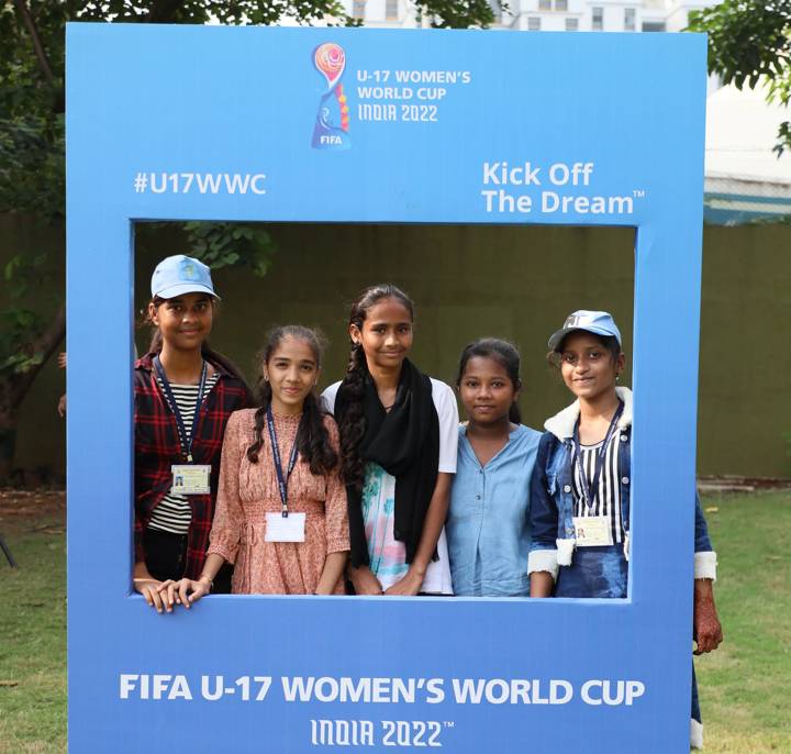 NGO girls pose with a FIFA U-17 Women's World Cup India 2022™ frame during an event in India