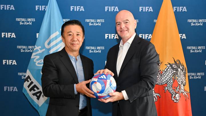 PARIS, FRANCE - AUGUST 07: FIFA President Gianni Infantino and Bhutan Football Federation President Dasho Ugyen Tsechup Dorji pose for a photo with Olympic Games Paris 2024 official match ball during a meeting between FIFA and the Bhutan Football Federation President at FIFA's Paris office on August 07, 2024 in Paris, France. (Photo by Harold Cunningham/FIFA)