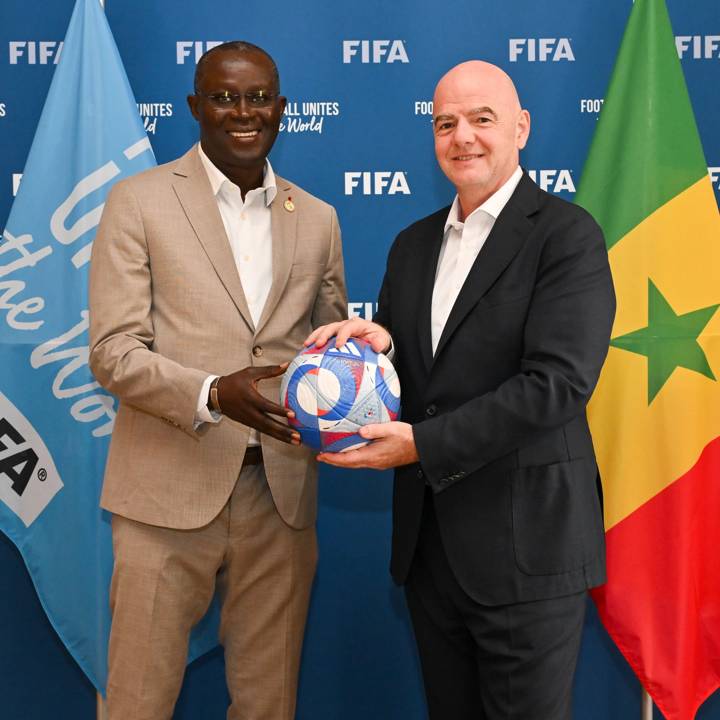 PARIS, FRANCE - AUGUST 07: FIFA President Gianni Infantino and the Senegalese Football Federation President Augustin Senghor pose for a photo with Olympic Games Paris 2024 official match ball during a meeting between FIFA and the Senegalese Football Federation President at FIFA's Paris office on August 07, 2024 in Paris, France. (Photo by Harold Cunningham/FIFA)