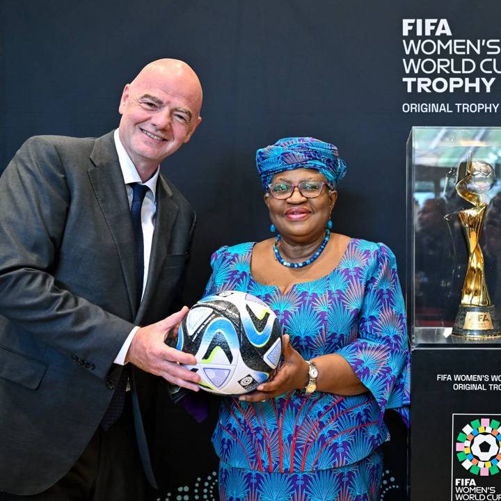 GENEVA, SWITZERLAND - MAY 01: FIFA President Gianni Infantino (L) and World Trade Organization General-Director Dr Ngozi Okonjo-Iweala (R) pose with "OCEAUNZ", the Official Match Ball of the FIFA Womens World Cup 2023 and the FIFA Women's World Cup Original Trophy during Making Trade Score for Women! at WTO headquarters on May 01, 2023 in Geneva, Switzerland. (Photo by Harold Cunningham/FIFA)