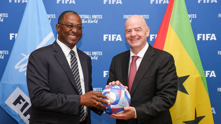 PARIS, FRANCE - JULY 31: FIFA President Gianni Infantino and São Toméan Football Federation President Domingos Monteiro pose with an Olympic Games Paris 2024 official match ball during a meeting between FIFA and the São Toméan Football Federation at FIFA's Paris office on July 31, 2024 in Paris, France. (Photo by Léo-Paul Ridet/FIFA)