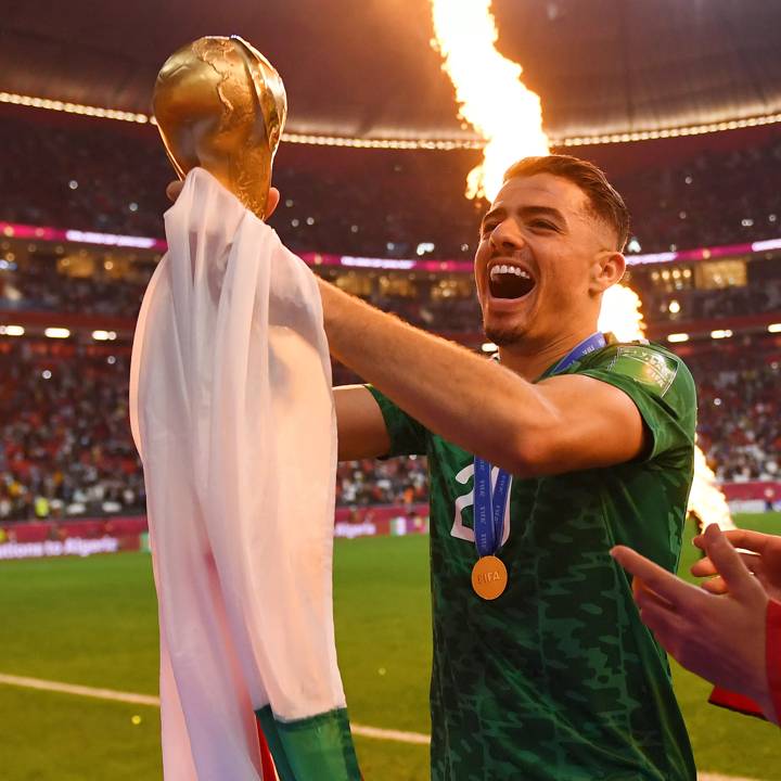 AL KHOR, QATAR - DECEMBER 18: Ilyes Cheti of Algeria celebrates with the FIFA Arab Cup trophy following victory during the FIFA Arab Cup Qatar 2021 Final match between Tunisia and Algeria at Al Bayt Stadium on December 18, 2021 in Al Khor, Qatar. (Photo by David Ramos - FIFA/FIFA via Getty Images)