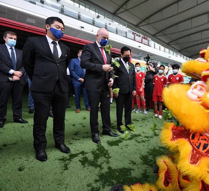 FIFA President Gianni Infantino is greeted by a lion dance performance at the opening of the Football Association of Singapore's new headquarters.