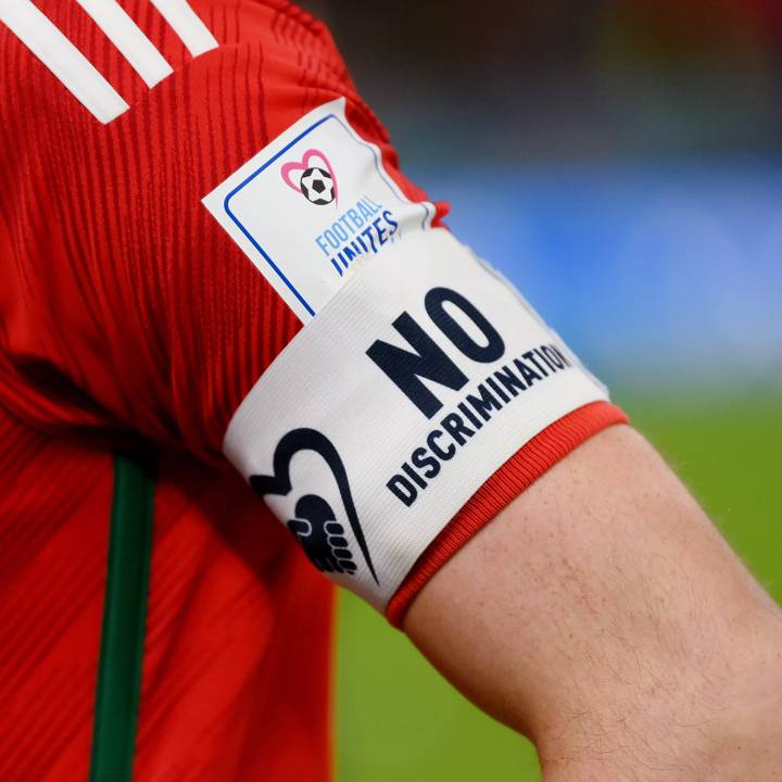 DOHA, QATAR - NOVEMBER 21: Detail of the No Discrimination captain's armband of Gareth Bale of Wales during the FIFA World Cup Qatar 2022 Group B match between USA and Wales at Ahmad Bin Ali Stadium on November 21, 2022 in Doha, Qatar. (Photo by David Ramos - FIFA/FIFA via Getty Images)