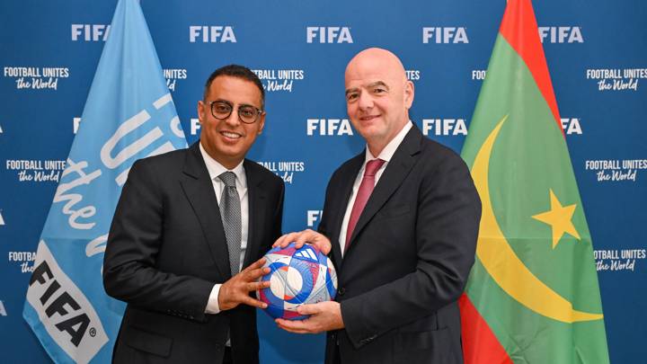 PARIS, FRANCE - AUGUST 07: FIFA President Gianni Infantino and the Football Federation of the Islamic Republic of Mauritania President Ahmed Yahya pose with the Olympic Games Paris 2024 official match during a meeting between FIFA and the Football Federation of the Islamic Republic of Mauritania President at FIFA's Paris office on August 07, 2024 in Paris, France. (Photo by Harold Cunningham/FIFA)