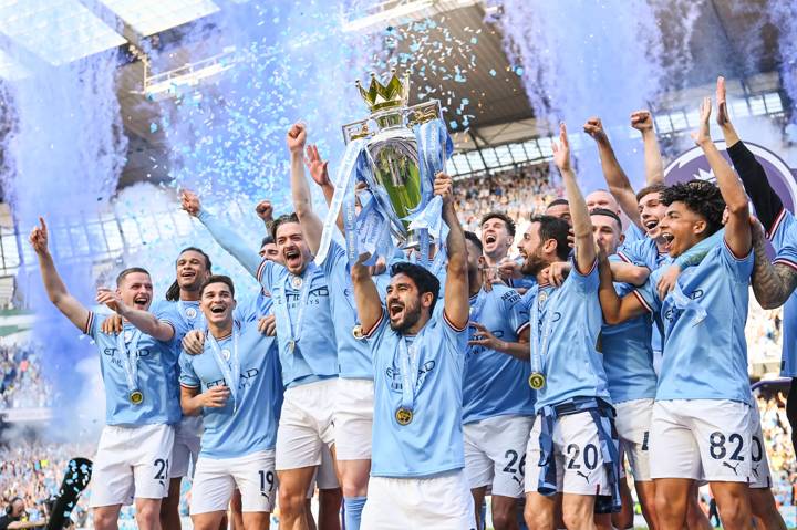 Manchester City captain Ilkay Gundogan lifts the Premier League trophy after the Premier League match between Manchester City and Chelsea FC at Etihad Stadium on May 21, 2023 