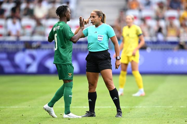 Kabange Mupopo #9 of Team Zambia interacts with Referee Emikar Calderas