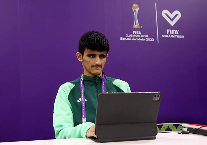 Volunteer Rakan Al Zahrani is seen at his desk working