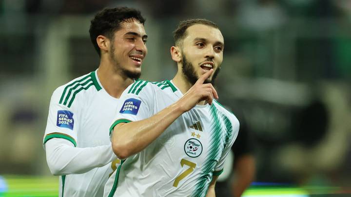 ALGIERS, ALGERIA - MARCH 22: Amine Ferid Ghouiri of Algeria (R) celebrates with teammate Fares Chaibi after scoring their team's first goal during the FIFA Series 2024 Algeria match between Algeria and Bolivia at Nelson Mandela Stadium on March 22, 2024 in Algiers, Algeria. (Photo by Richard Pelham - FIFA/FIFA via Getty Images)