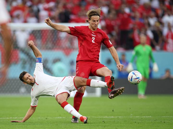 AL RAYYAN, QATAR - NOVEMBER 22: Joachim Andersen of Denmark battles for possession with Youssef Msakni of Tunisia during the FIFA World Cup Qatar 2022 Group D match between Denmark and Tunisia at Education City Stadium on November 22, 2022 in Al Rayyan, Qatar. (Photo by Adam Pretty - FIFA/FIFA via Getty Images)