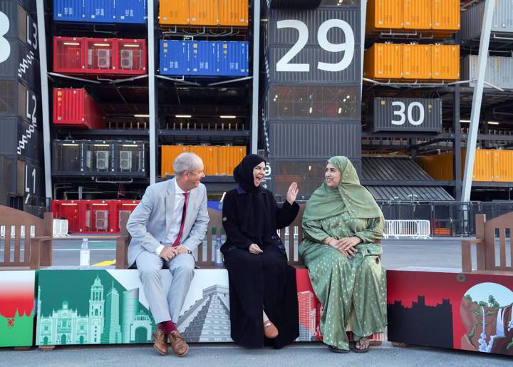 Ministry of Public Health officials in Doha, pictured on a Friendship Bench at 974 Stadium in Doha