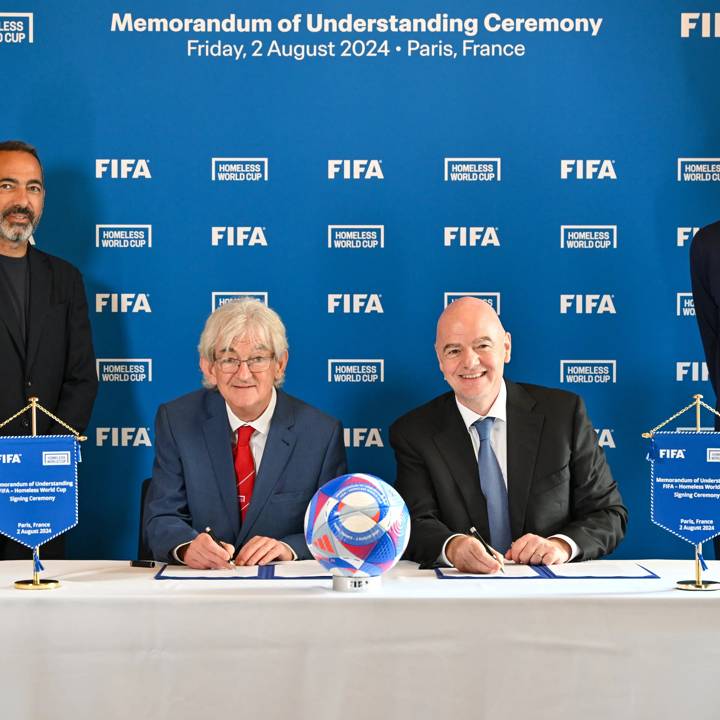 PARIS, FRANCE - AUGUST 02: (L-R) FIFA Senior Football Advisor Youri Djorkaeff, President and Founder of the Homeless World Cup Mel Young, FIFA President Gianni Infantino and FIFA Chief of Global Football Development Arsène Wenger during Signing of the Memorandum of Understanding (MoU) between FIFA and Homeless World Cup Foundation ceremony at FIFA's Paris office on August 02, 2024 in Paris, France. (Photo by Harold Cunningham/FIFA)