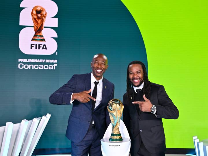 Draw Assistants Paulo Wanchope (L) and Ricardo Gardner pose with the FIFA World Cup 26 Winner's Trophy prior to the Concacaf Qualifiers for FIFA World Cup 2026 - Preliminary Draw at Home of FIFA 