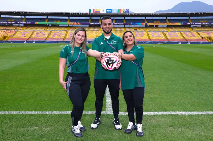 Karen, Miguel and Paola Romero Chavez pose with the official match ball prior to the FIFA U-20 Women's World Cup Colombia 2024