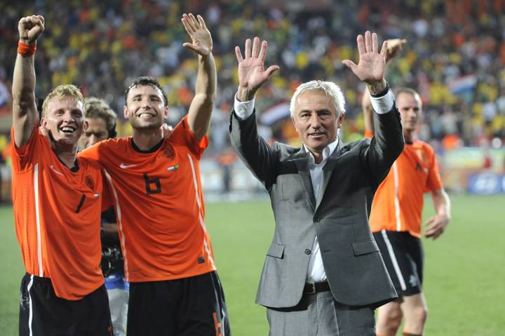 Bert van Marwijk celebrates with his players at the 2010 FIFA World Cup.