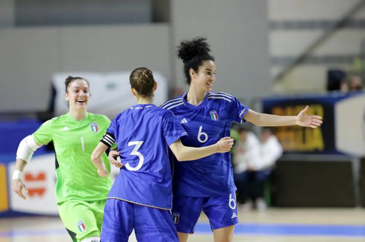 Players of the Italian women's futsal national team celebrate