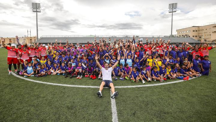 BELIZE CITY, BELIZE - AUGUST 17: FIFA Technical Consultant Juan Pablo Ángel poses with attendees for a group photo during Football for Schools at Princess Ramada Hotel on August 17, 2022 in Belize City, Belize. (Photo by Ivan Valencia/FIFA)