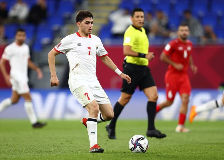 Mohammad Abu Zraiq of Jordan runs with the ball 