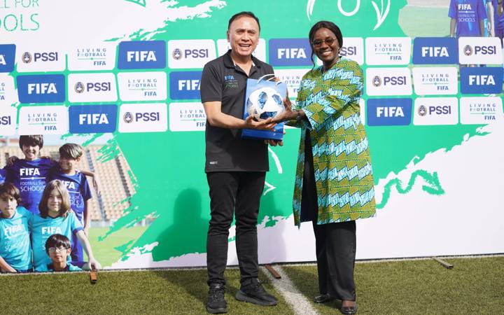 PSSI President Mochamad Iriawan (L) and Fatimata Sidibe from Football for Schools programme pose for a photo during a Football for Schools course in Indonesia