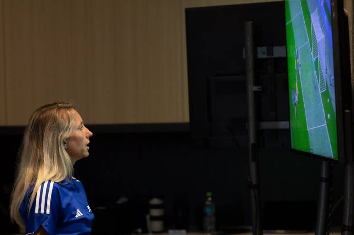 Tori Penso of USA check on tv during a VAR class