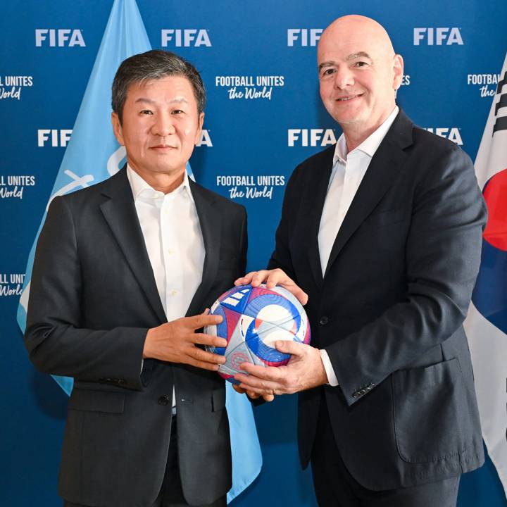 PARIS, FRANCE - AUGUST 06: FIFA President Gianni Infantino and Korea Football Association President Chung Mong-gyu pose for a photo with the Olympic Games Paris 2024 official match ball during a meeting between FIFA and the Korea Football Association President at FIFA's Paris office on August 06, 2024 in Paris, France. (Photo by Harold Cunningham/FIFA)