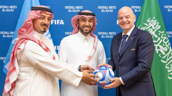 PARIS, FRANCE - JULY 28: (L-R) FIFA Council Member and Saudi Arabian Football Federation President Yasser Al Misehal, Saudi Arabia Minster for Sport HRH Prince Abdulaziz bin Turki Al-Faisal and FIFA President Gianni Infantino pose with an Olympic Games Paris 2024 official match ball during a meeting at FIFA's Paris office on July 28, 2024 in Paris, France. (Photo by Léo-Paul Ridet/FIFA)