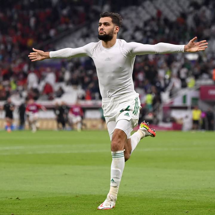 DOHA, QATAR - DECEMBER 11: Mohamed Tougai of Algeria celebrates scoring their team's fifth and winning penalty in the penalty shootout during the FIFA Arab Cup Qatar 2021 Quarter-Final match between Morocco and Algeria at Al Thumana Stadium on December 11, 2021 in Doha, Qatar. (Photo by Michael Regan - FIFA/FIFA via Getty Images)