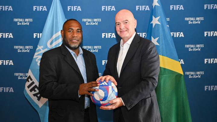 PARIS, FRANCE - AUGUST 06: FIFA President Gianni Infantino and Solomon Islands Football Federation President Donald Marahare pose with the Olympic Games Paris 2024 official match ball during a meeting between FIFA and the Solomon Islands Football Federation President at FIFA's Paris office on August 06, 2024 in Paris, France. (Photo by Harold Cunningham/FIFA)