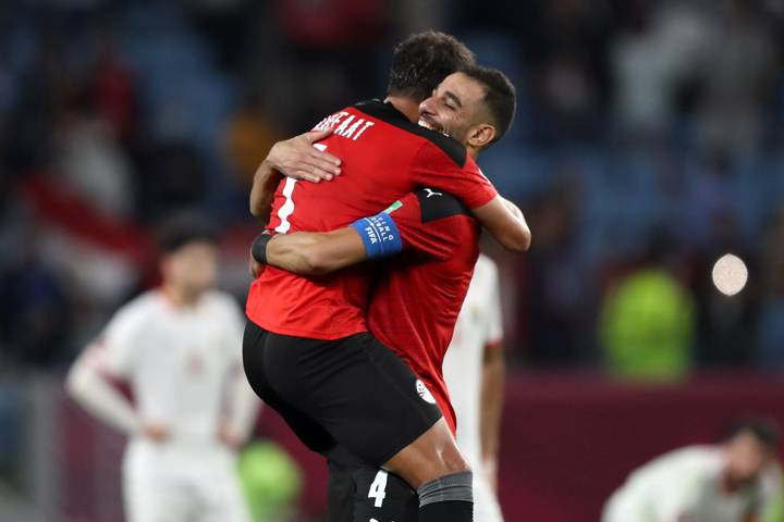 Amro Elsoulia and Ahmed Refaat of Egypt celebrate victory following the FIFA Arab Cup Qatar 2021 Quarter-Final match between Egypt and Jordan.