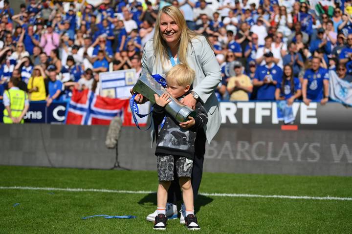 Emma Hayes, Manager of Chelsea, celebrates with the Barclays Women's Super League trophy and her son in May 27, 2023 