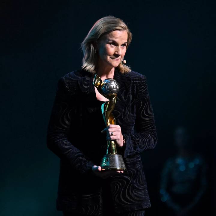 AUCKLAND, NEW ZEALAND - OCTOBER 22: FIFA Women's Technical Advisory Group Lead Jill Ellis carries the FIFA Women's World Cup Winner's Trophy on stage during the FIFA Women's World Cup 2023 Final Draw at the Aotea Centre on October 22, 2022 in Auckland, New Zealand. (Photo by Harold Cunningham - FIFA/FIFA via Getty Images)